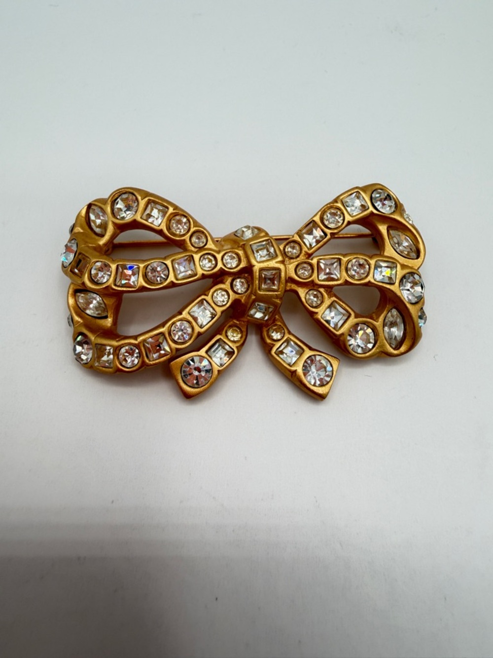 Signed AK Brushed Gold Bow Crystal Rhinestone Brooch
